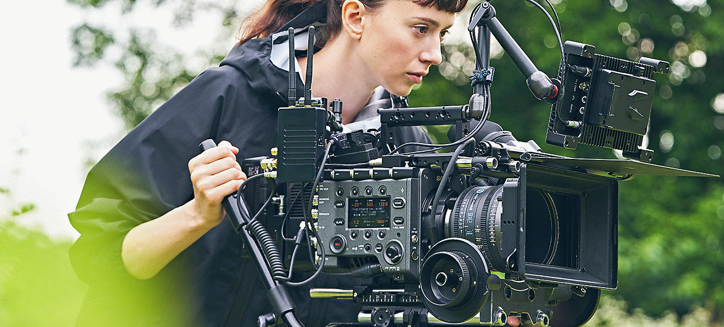 A filmmaker looking at a monitor