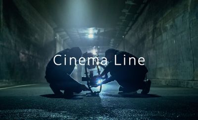 Image in which two people are setting up the camera