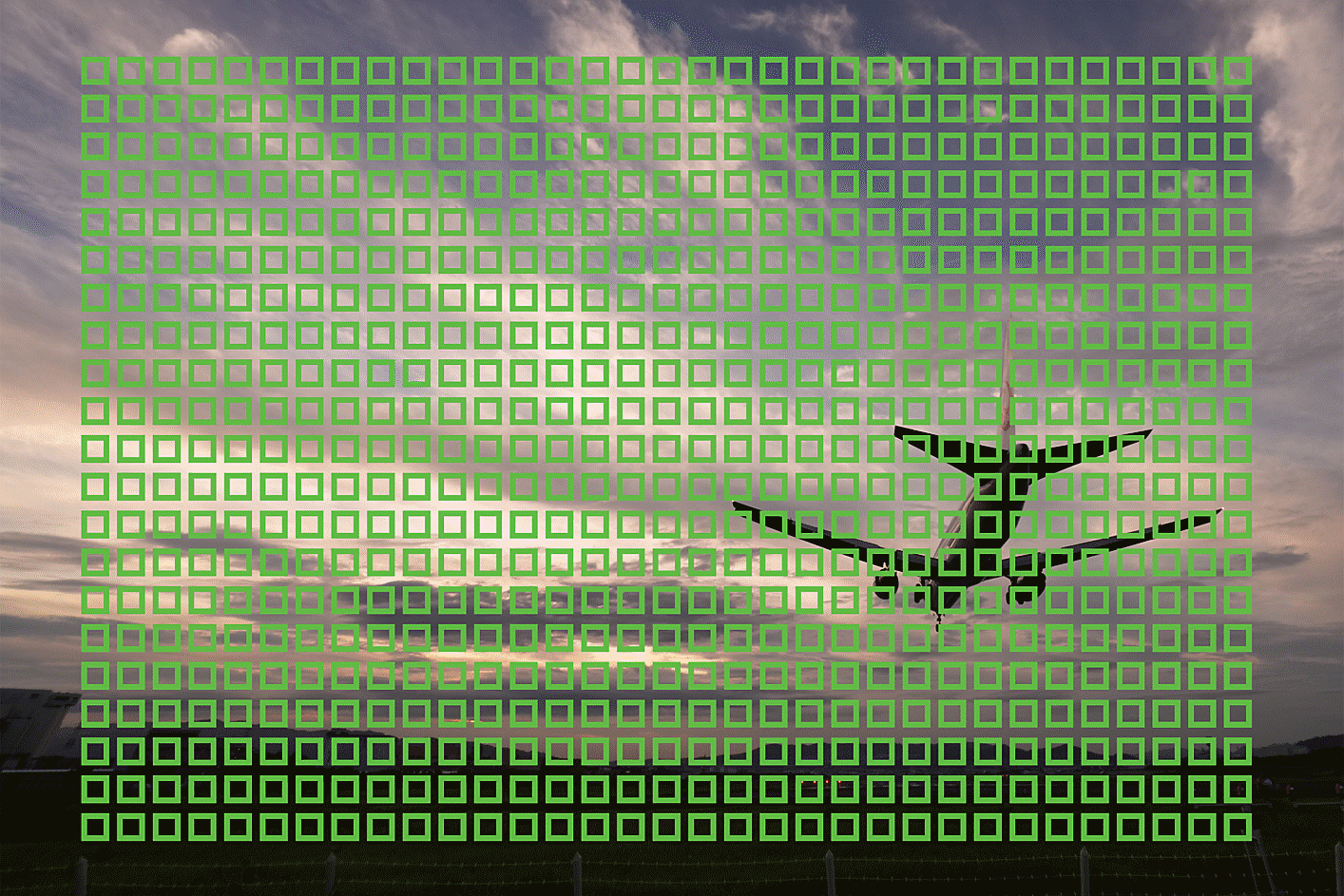 Example image of a flying airplane with small squares showing the 693 AF points across the image