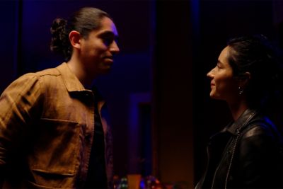 Image of a man and a woman talking face to face