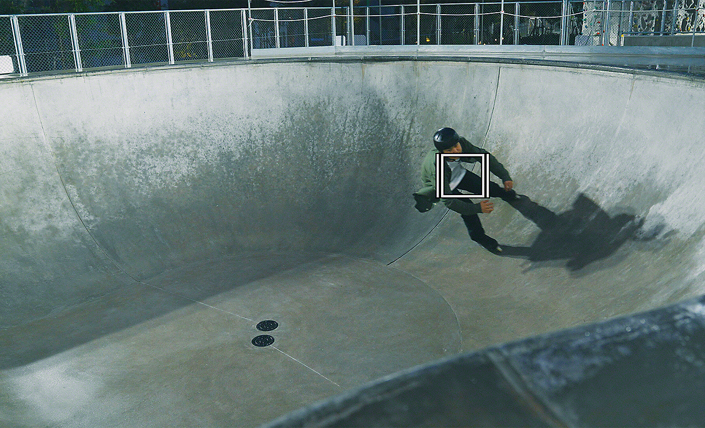 Roller blader skating in a disused swimming pool, overlaid with a white square for Object Tracking