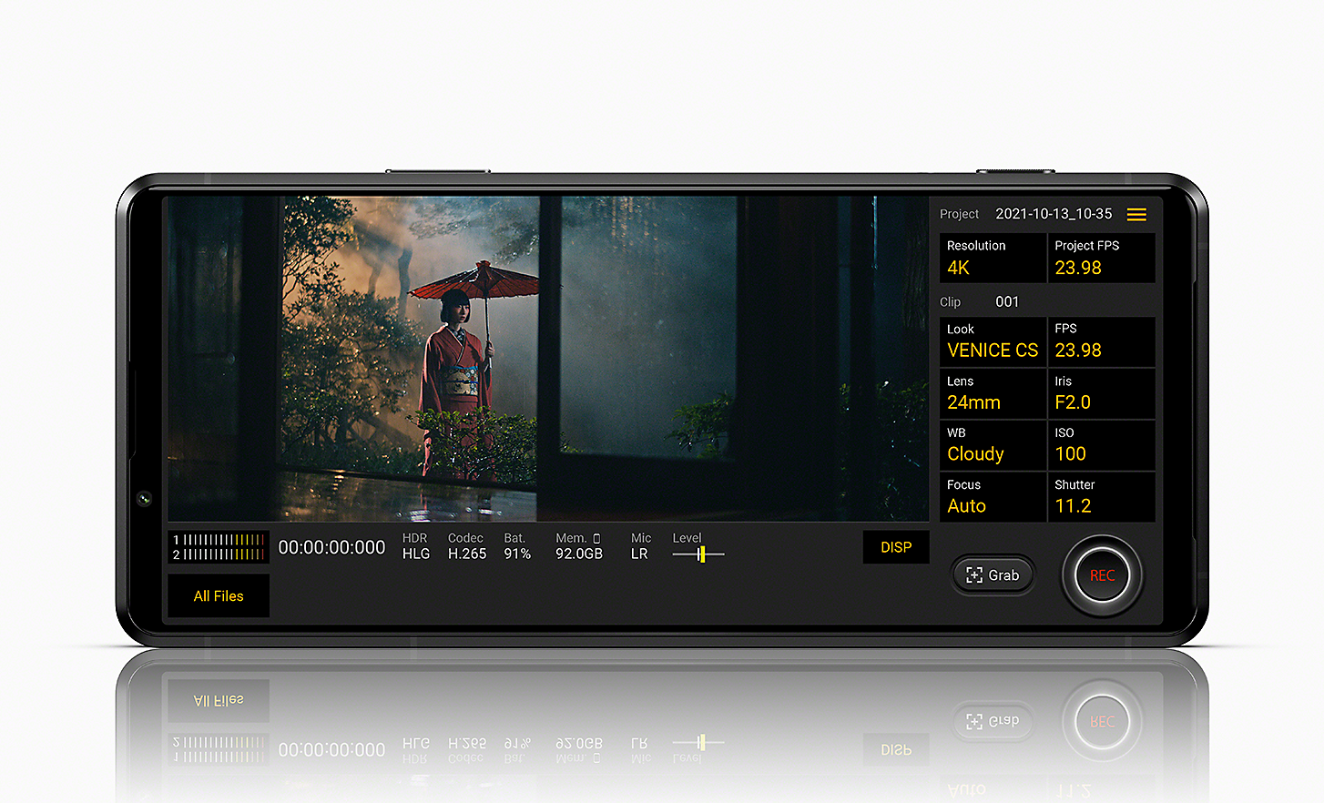 Xperia PRO-I display showing Cinematography Pro UI and a shot of a woman with parasol