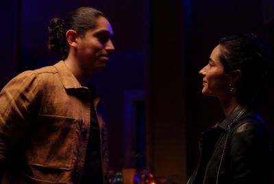 Image of a man and a woman talking face to face