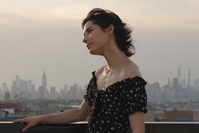 Image of a woman with a city background