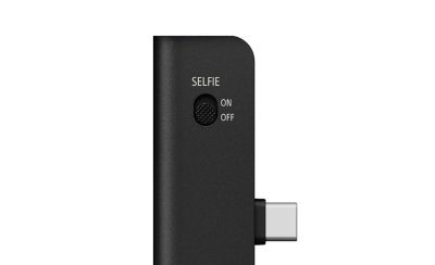 Close-up of the ECM-AX10 selfie switch with an "ON"/"OFF" slider beside a silver USB-C connector.
