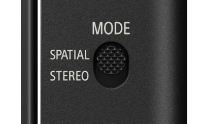 Close-up of the ECM-AX10 mode switch showing a textured black slider set between "SPATIAL" and "STEREO" options.
