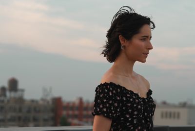 Image of a woman with a city background