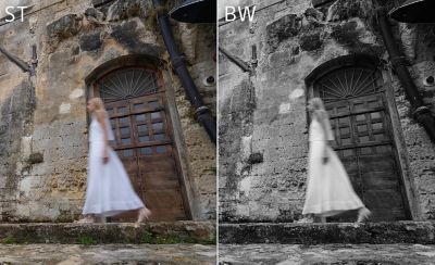 Image of a woman walking past a stone building, with the left in ST mode and the right in BW mode