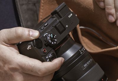 Usage image showing user taking the camera out of a bag