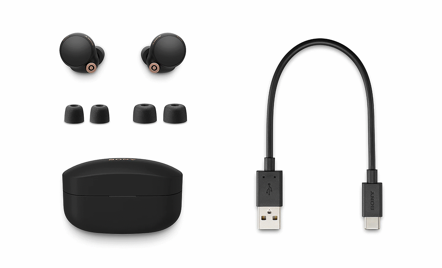 Par WF-1000XM4-hovedtelefoner med opladningsetui, 3 størrelser spidser til støjisolerende ørepuder + USB-C-opladningskabel.