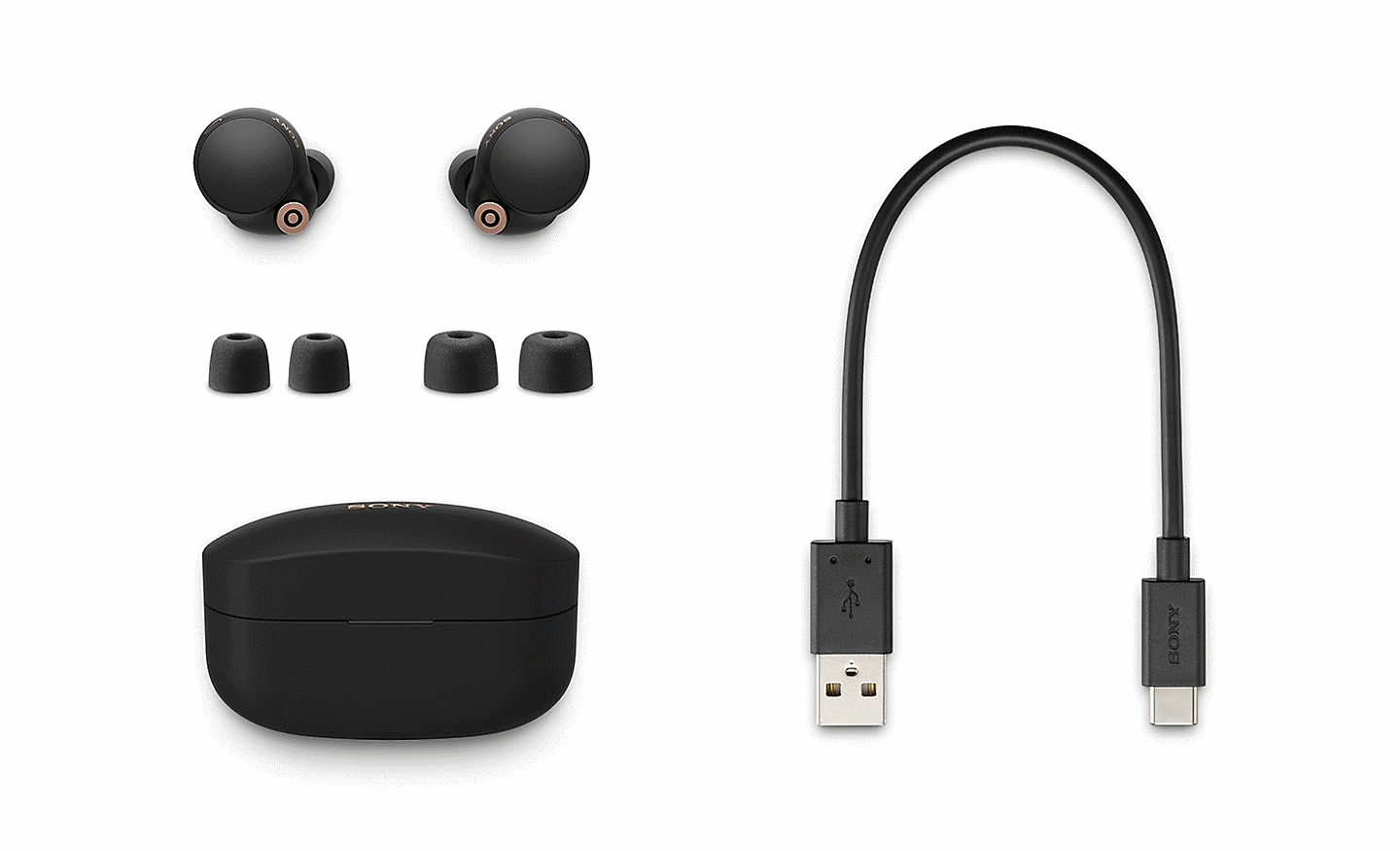 Pair of WF-1000XM4 headphones with charging case, three sizes of Noise Isolation Earbud Tips and a USB-C charging cable.