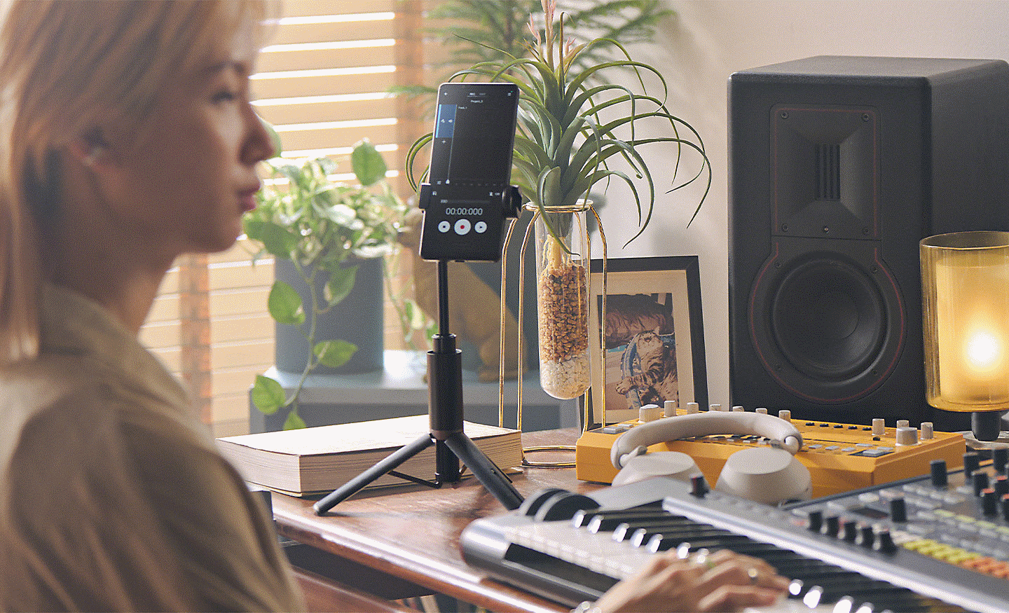 Image of a person playing a keyboard and recording on their Xperia 5 V
