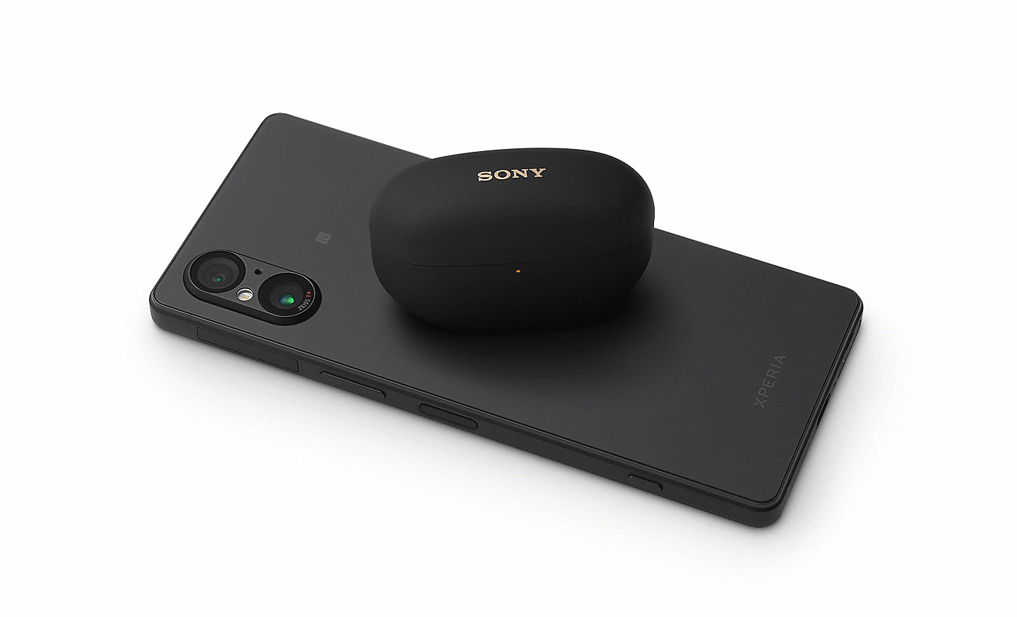 Image of a black Xperia 5 V with a Sony headphone case sitting on the back