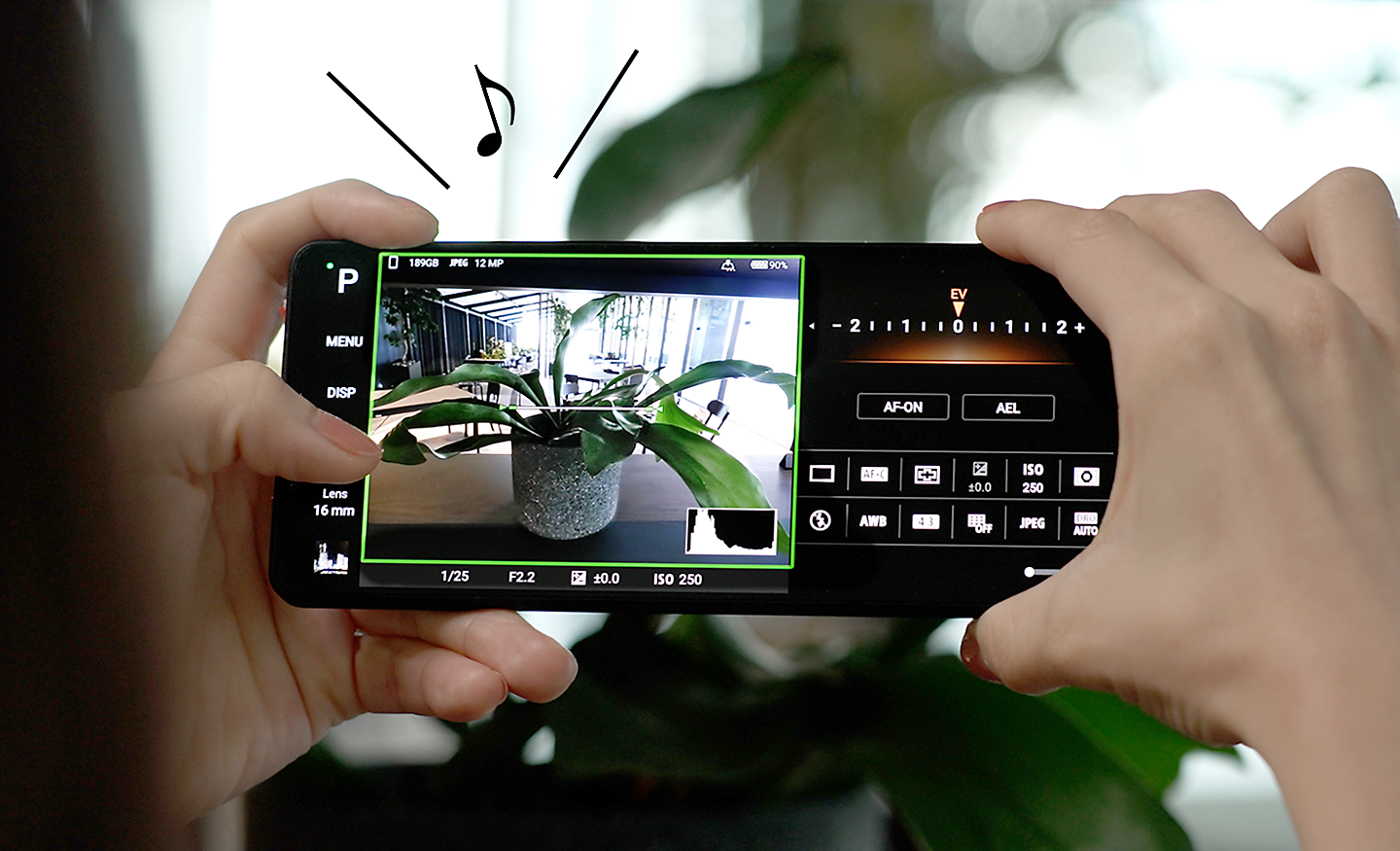 Image of a person taking a picture using Photography Pro on an Xperia 5 V with a music note and lines above for sound