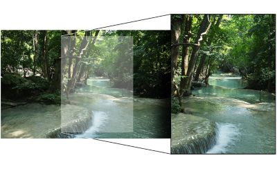 Landscape image of a river flowing through a forest.