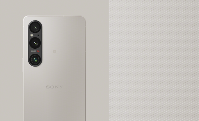 Rear-facing Xperia 1 V in Platinum Silver alongside an extreme close-up showing its textured finish