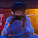A gamer concentrating hard as he plays on the Xperia 1 V 