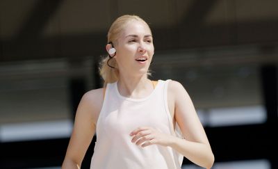 Image of a woman running in Sony Float Run headphones