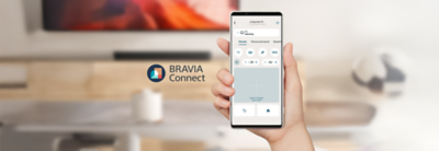 Image of hand holding a phone showing interface of BRAVIA Connect