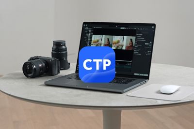 Está um computador de secretária e uma câmara na secretária e é apresentado o ecrã a ser editado com a Catalyst