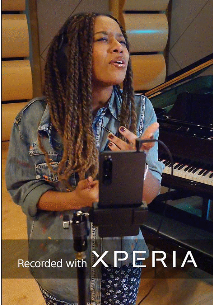 Video of Doe recording her singing performance on an Xperia 5 IV in a studio