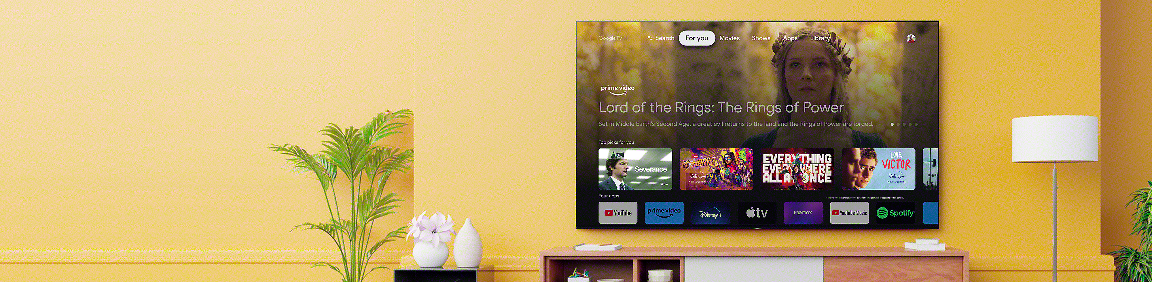 Living room with a wall-mounted BRAVIA TV displaying an array of entertainment apps and streaming services