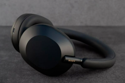 Image of Sony WH-1000XM5 headphone rested on a table surface