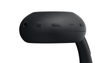 The base of one ear cup of a black 1000X THE COLLEXION headphone showing the port and control buttons 