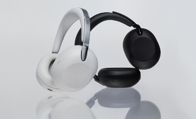 Two sets of 1000X THE COLLEXION headphones, one black and one white, against a white background