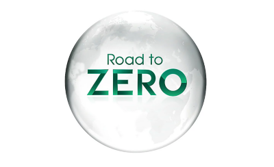 一個褪色的灰色地球儀上面寫著 Road to ZERO