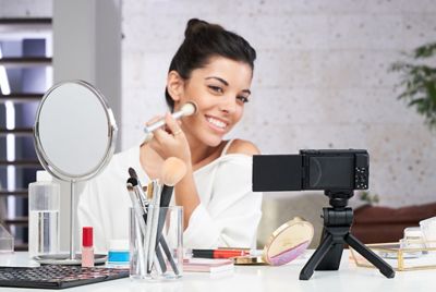 Selfie using a tripod during makeup.