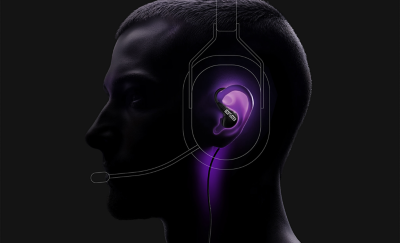 Profile view of a person wearing a headset with a thin cable running along the neck.
