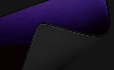 Mousepad corner flipped to reveal non-slip backing.
