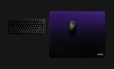 Top-down view of mouse on large mouse pad with size callout.