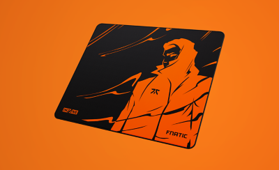  A black mousepad with an orange illustration on a bright orange background.