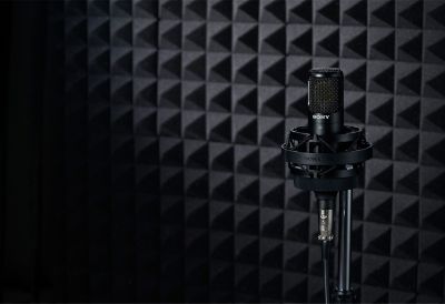 Image of the Sony C-80 Uni-directional condenser microphone with a soundproof wall in the background