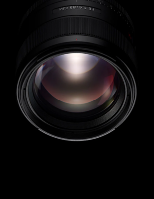 Black Sony Alpha lens on black background