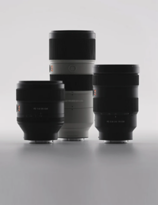 3 Sony Alpha lenses sit upright on a white surface