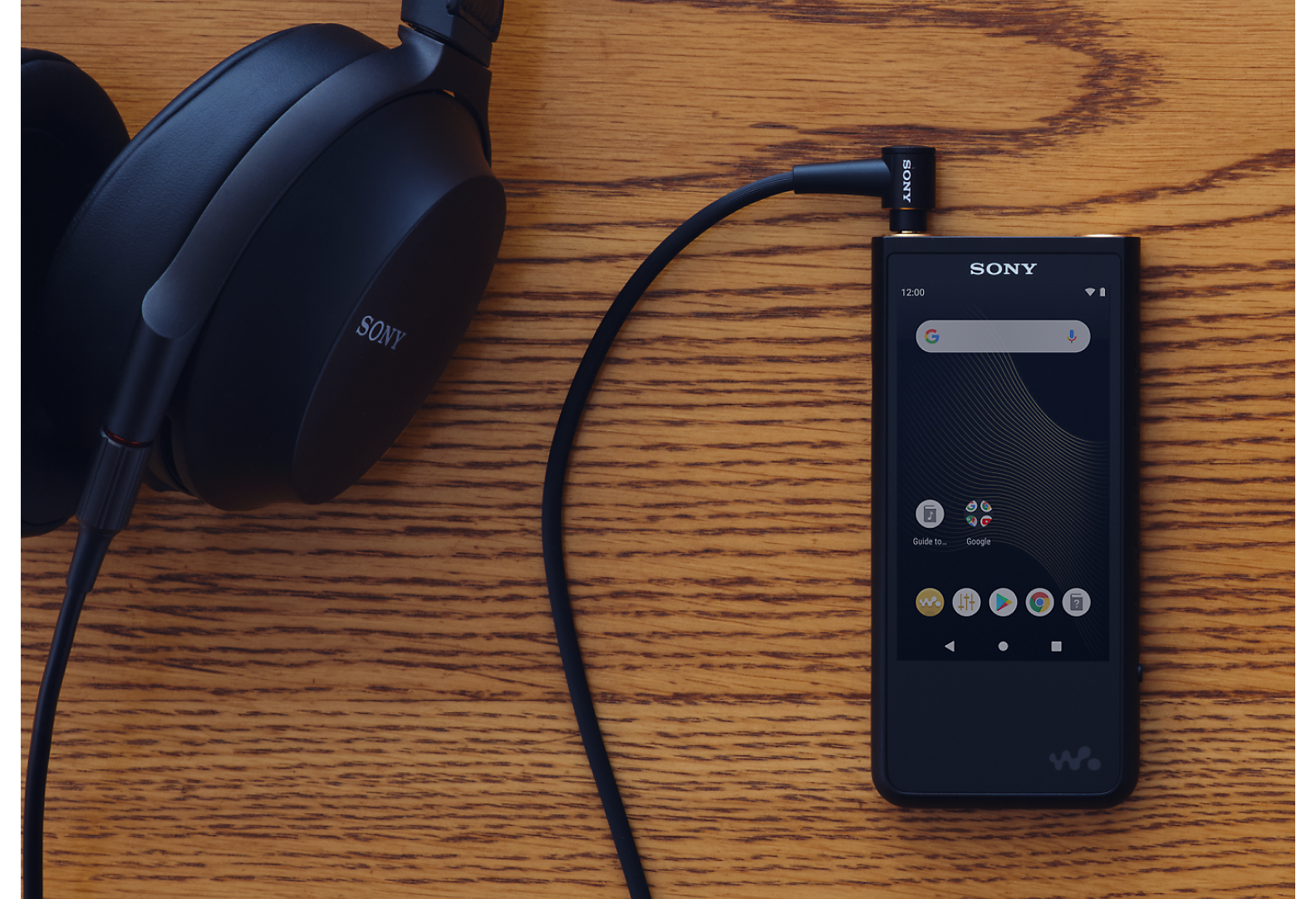 Portable Audio Player on Desk with Headphones
