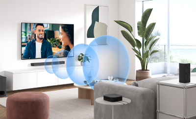 Living room setup with BRAVIA Theatre System 6 soundbar projecting sound waves.
