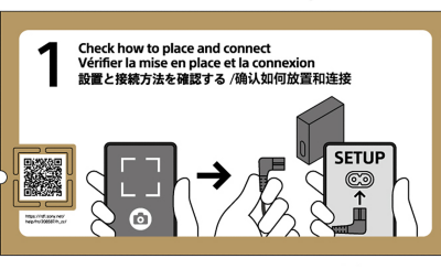  Step 1 setup guide showing a QR code, a smartphone scanning the code, a power cable, and a device with a "Setup" screen, designed to assist users who are blind or have low vision via a web help guide with screen reader support.