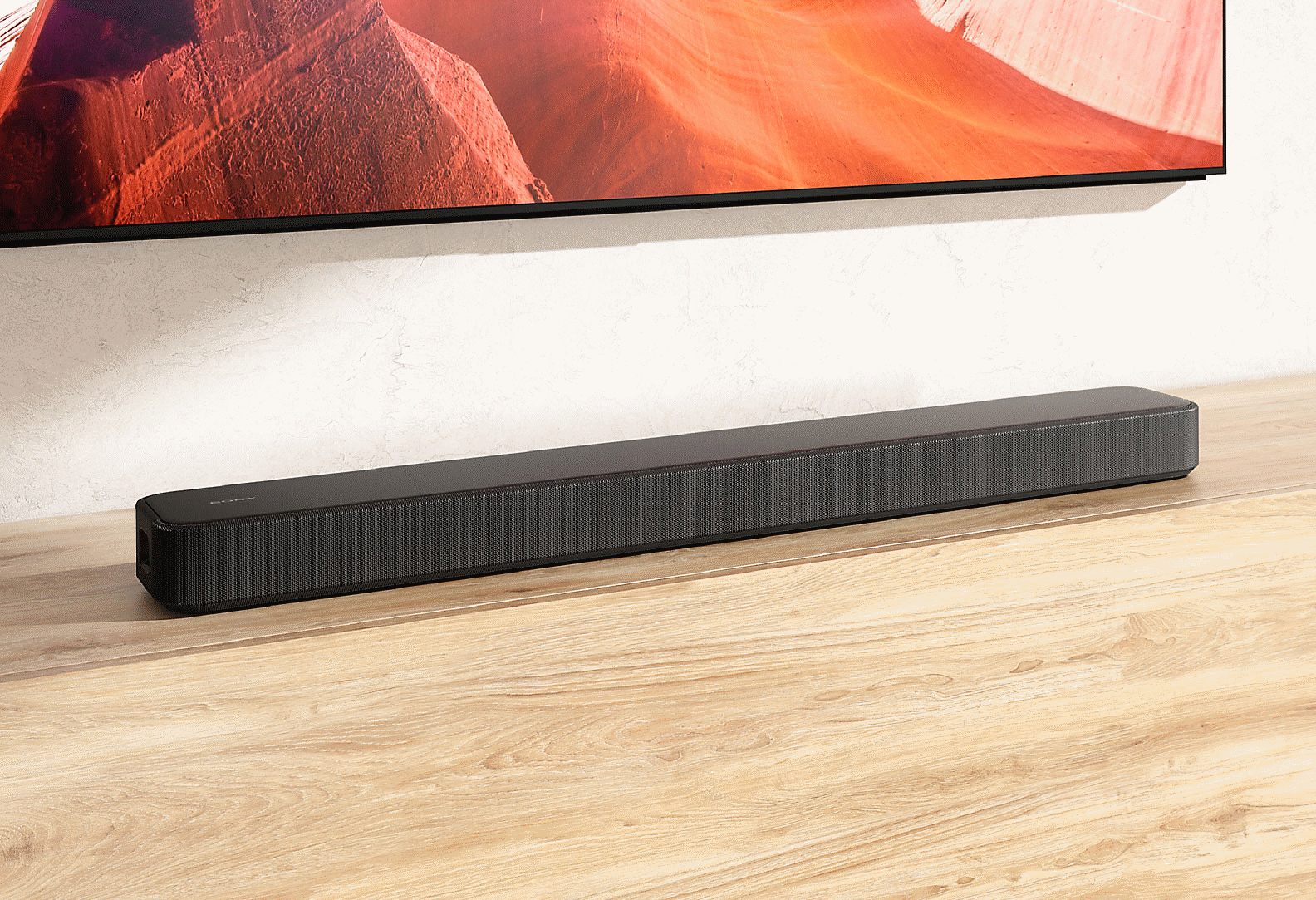 Image de la barre de son HT-S2000 sur un meuble de téléviseur en bois