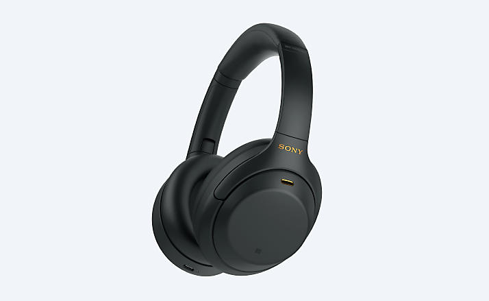Wireless headband headphones on grey background