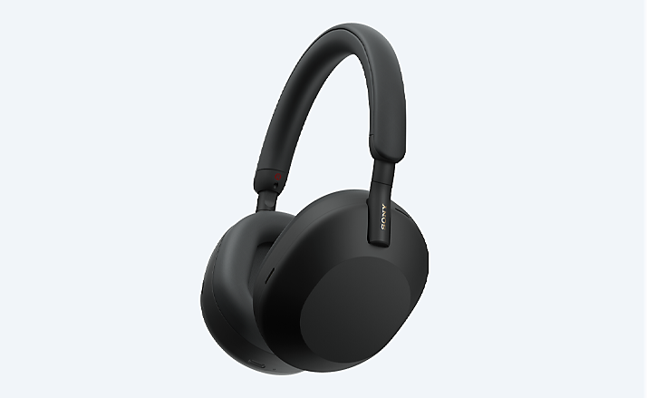 Wireless headband headphones on gray background