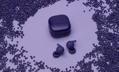 Image of violet LinkBuds Open headphones among recycle plastic materials