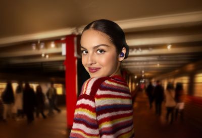 Olivia Rodrigo wearing violet LinkBuds Open headphones