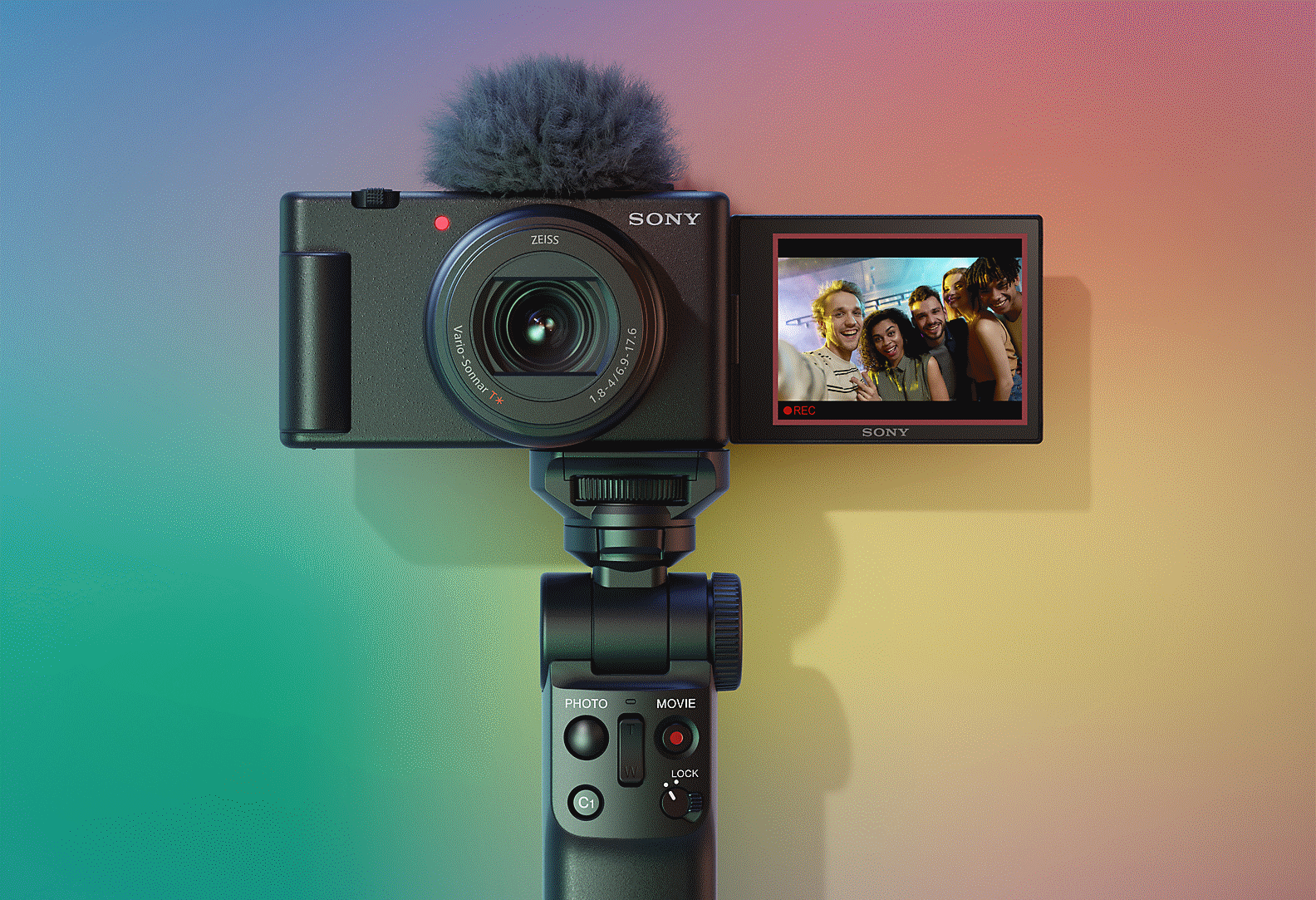 Front view of camera, with monitor open (black)