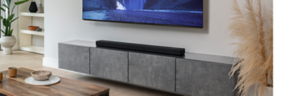 Angled front shot of HT-A5000 in a living room under a BRAVIA TV