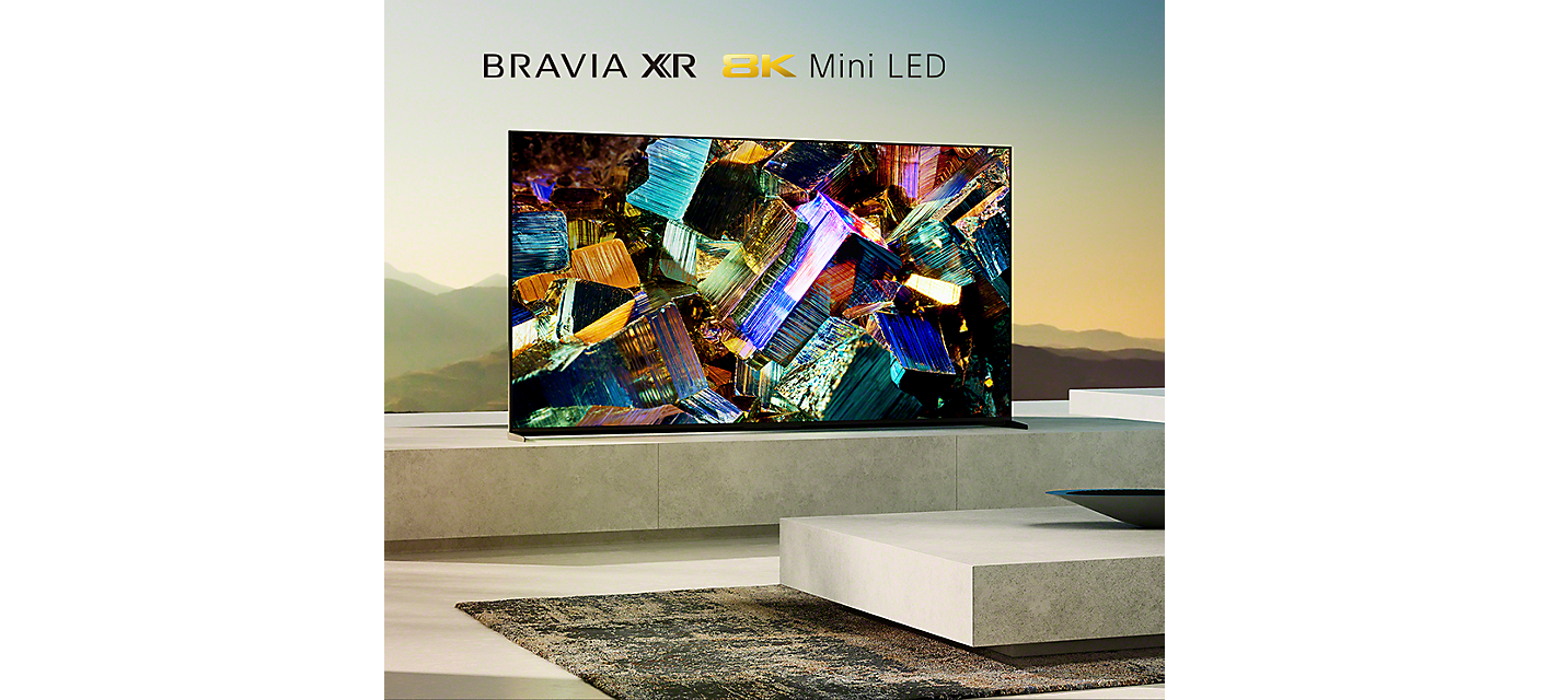 BRAVIA Z9K on marble plinth in living room with image of colourful foil boxes on screen
