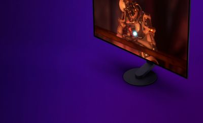 The new M10S Gaming Monitor facing to the left in front of a purple background with gaming graphics on the monitor.